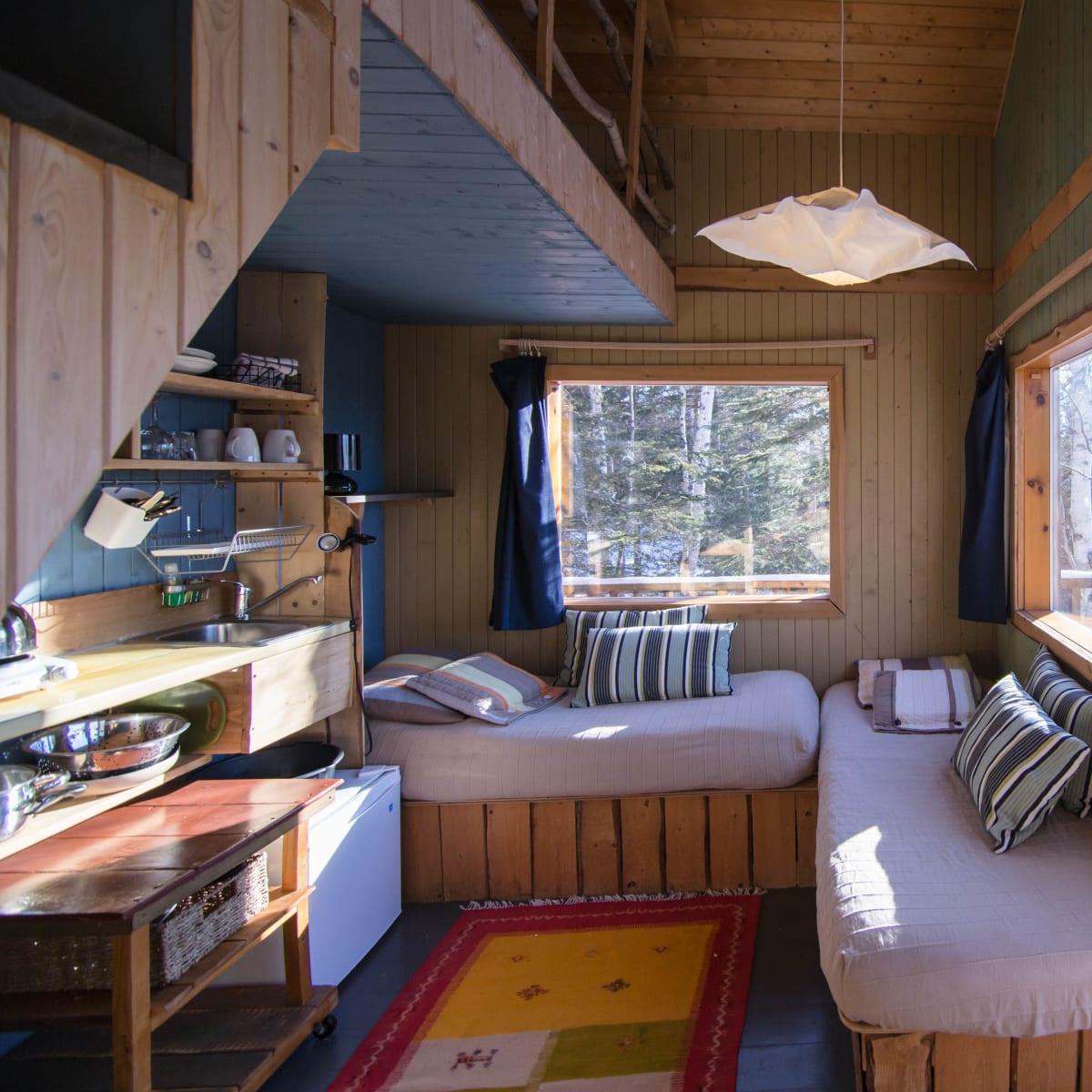 Vue intérieur d'un chalet à Canopée-lit.