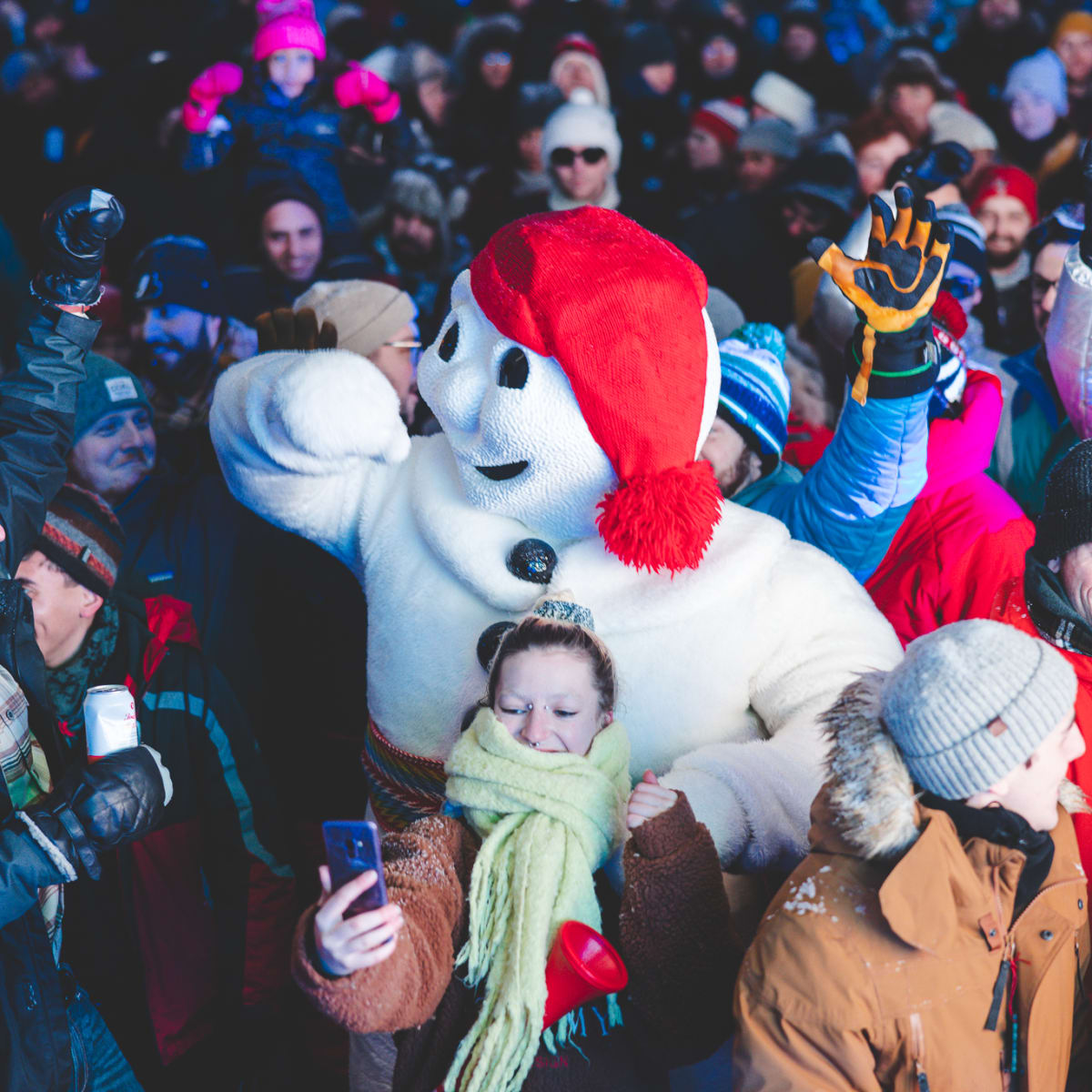 Québec Winter Carnival - Bonhomme Carnaval in a crowd outside
