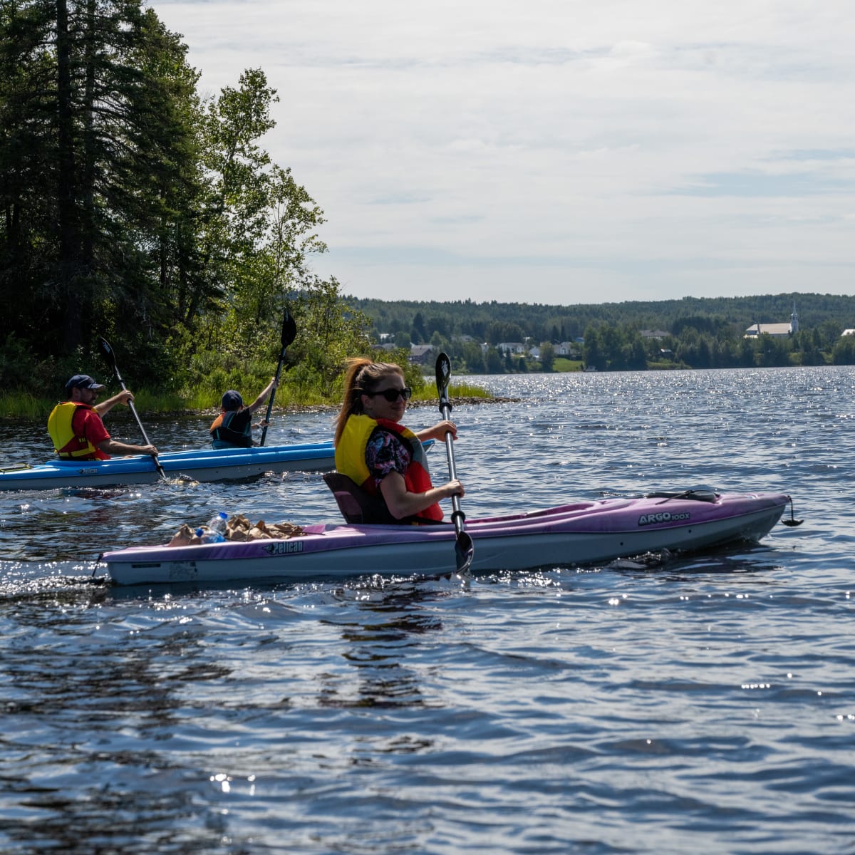 3 people in kayaks at Ermitage Saint-Antoine.