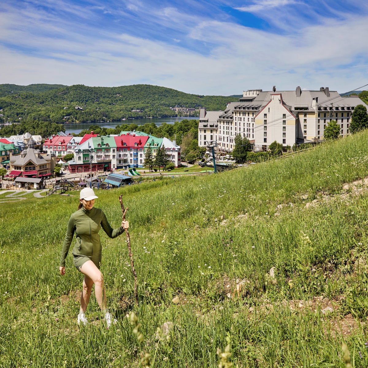 Woman hiking next to Fairmont Tremblant.