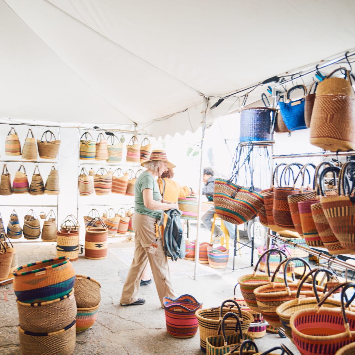 Twist Fibre Festival - A boutique selling bags and baskets, under a white tent