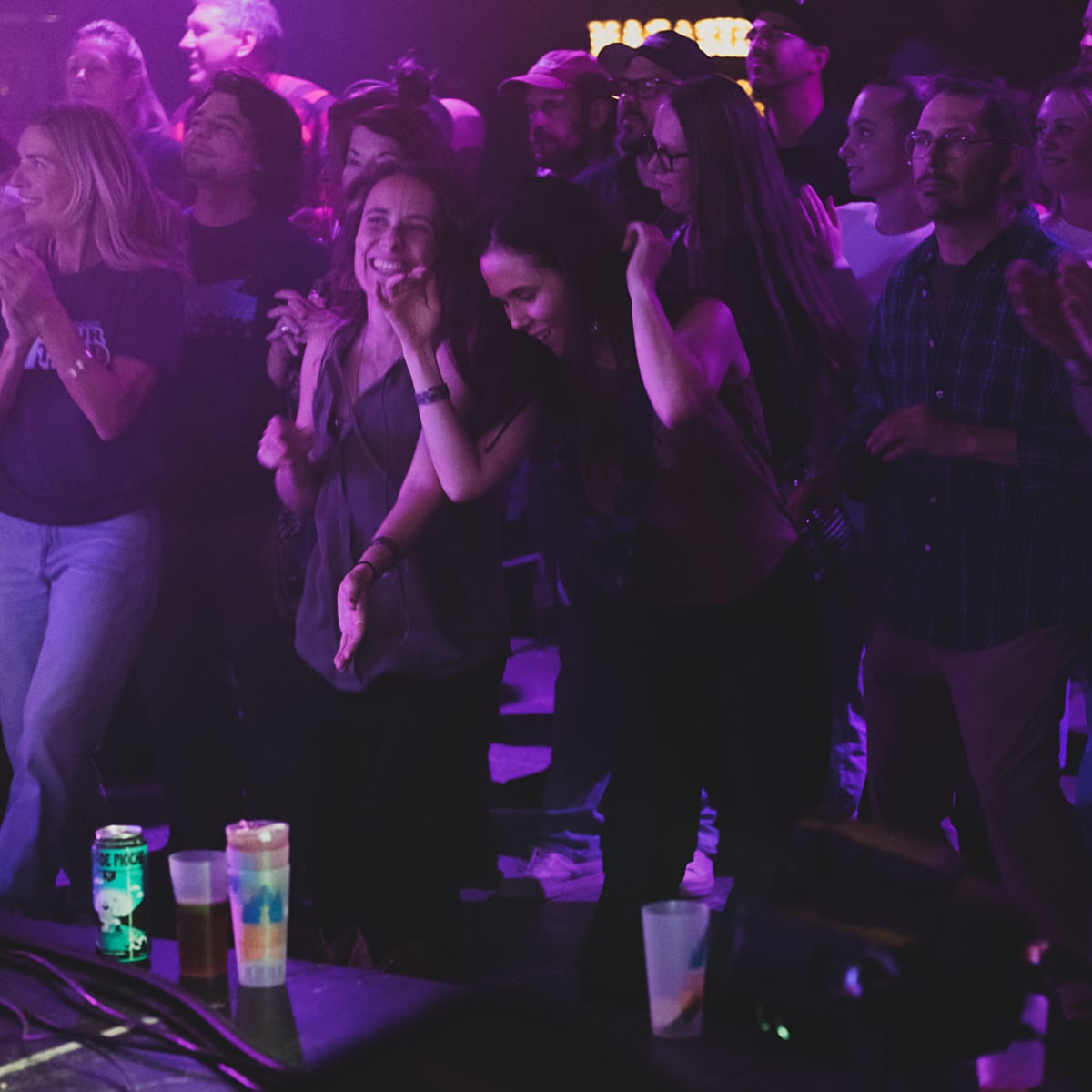 Val-d'Or Traditionnal Music Festival - A dancing crowd, under purple lighting.
