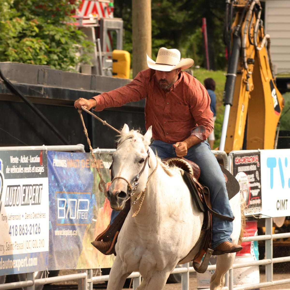 Man on a horse in a rodeo.