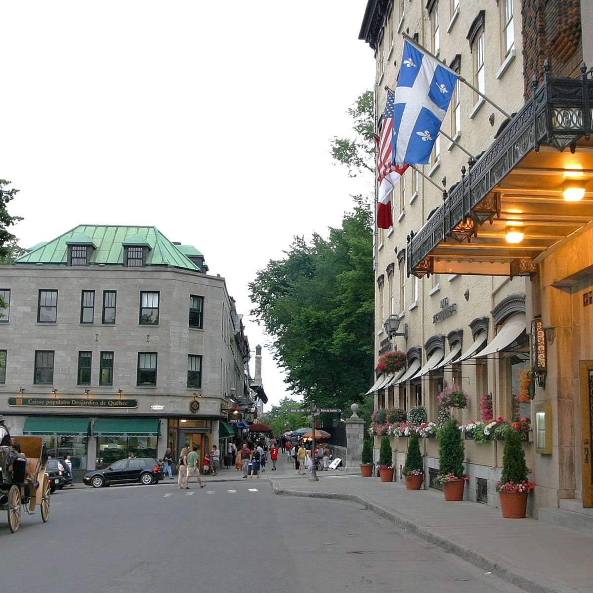 Front of Hotel Clarendon, with a horse-drawn carriage in the street.