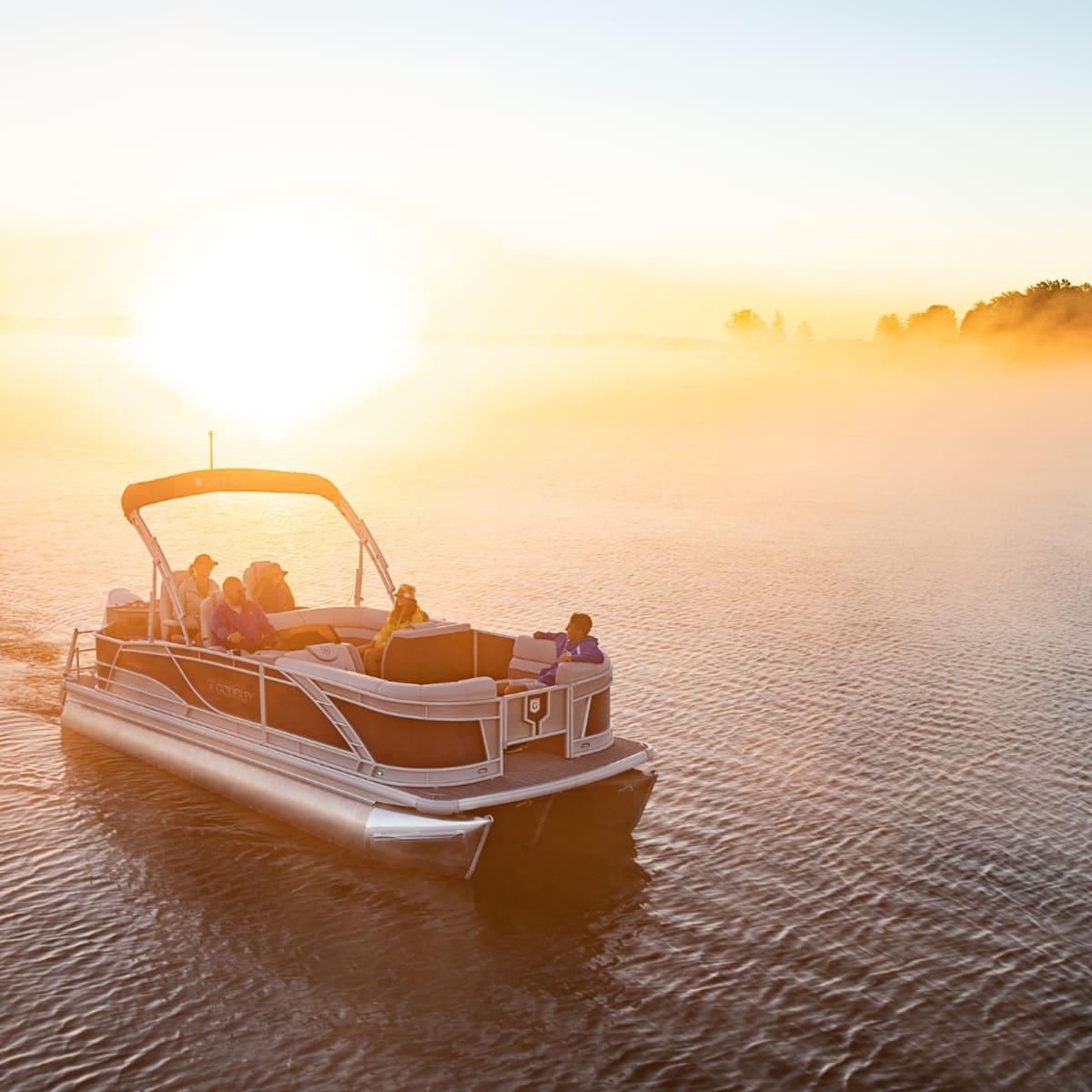 Pontoon on the lake in Magog at sunset.