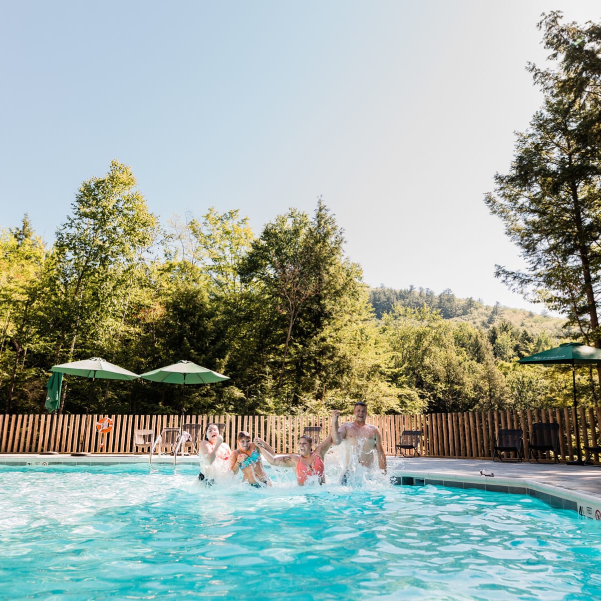 Family in a pool at Huttopia Sutton. 