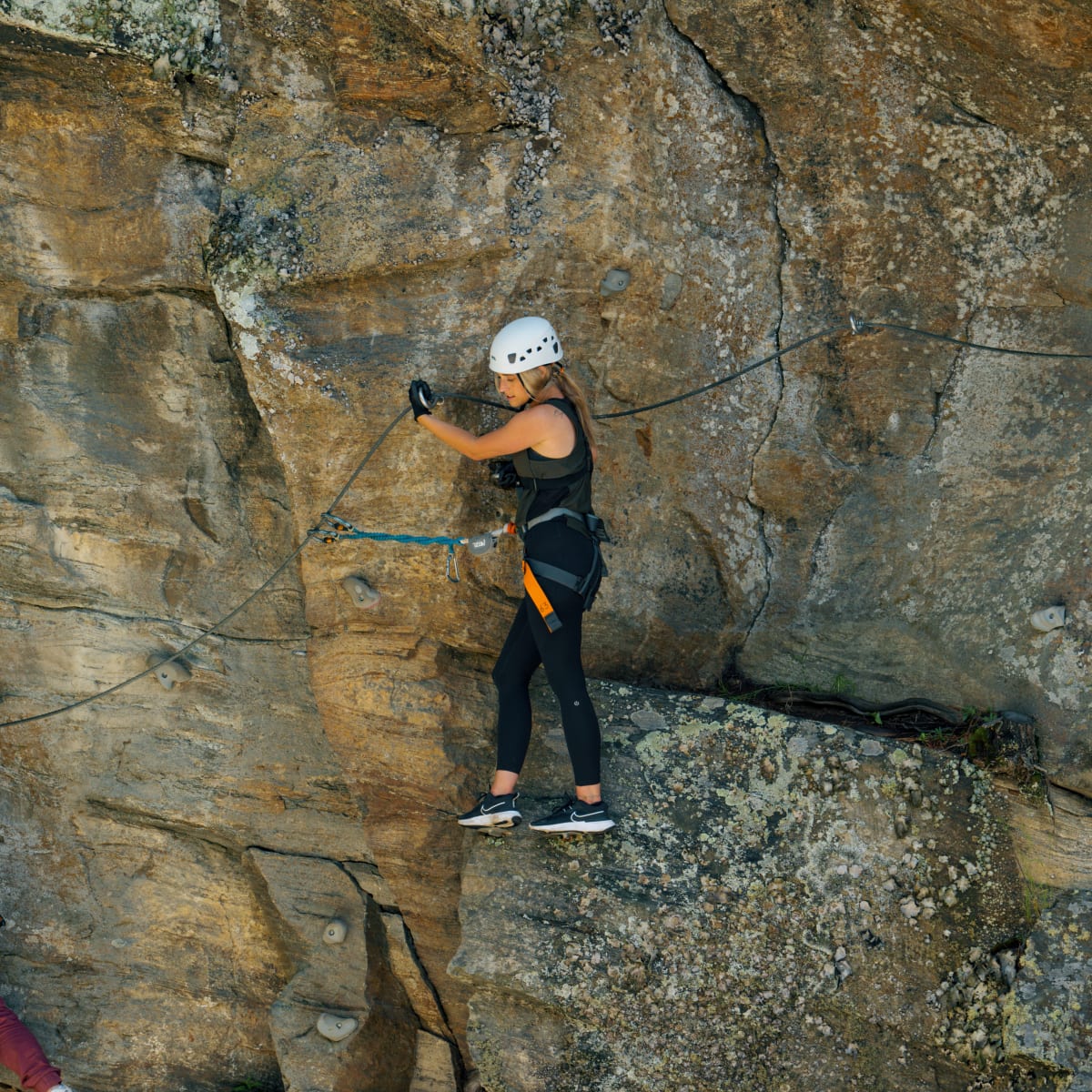 Two people doing via ferrata
