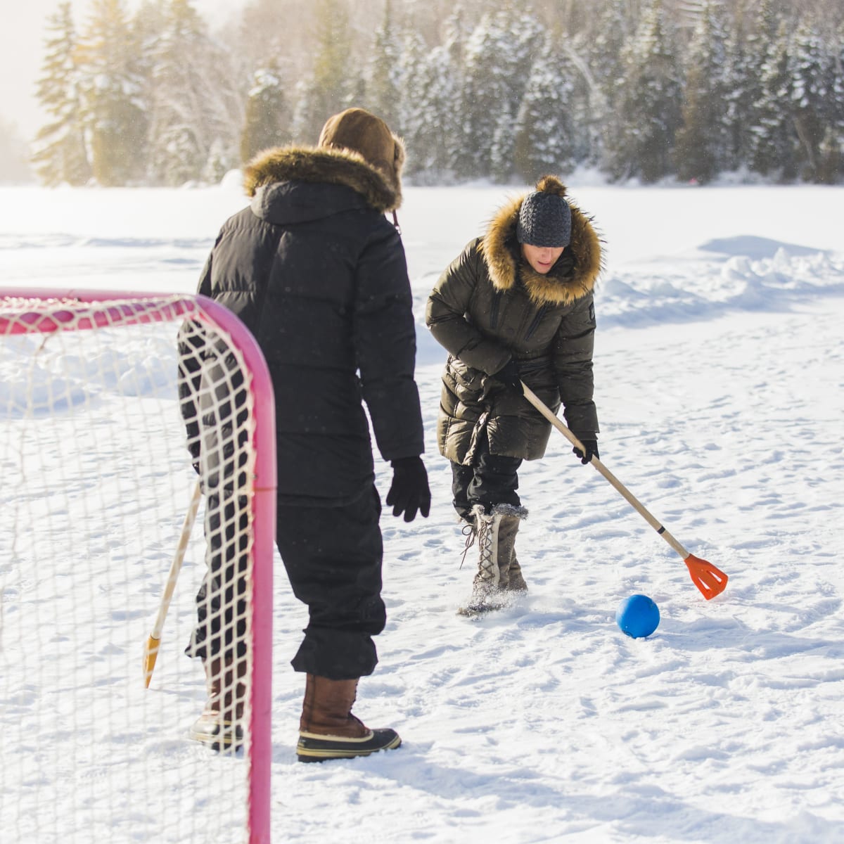 A couple playing in the snow