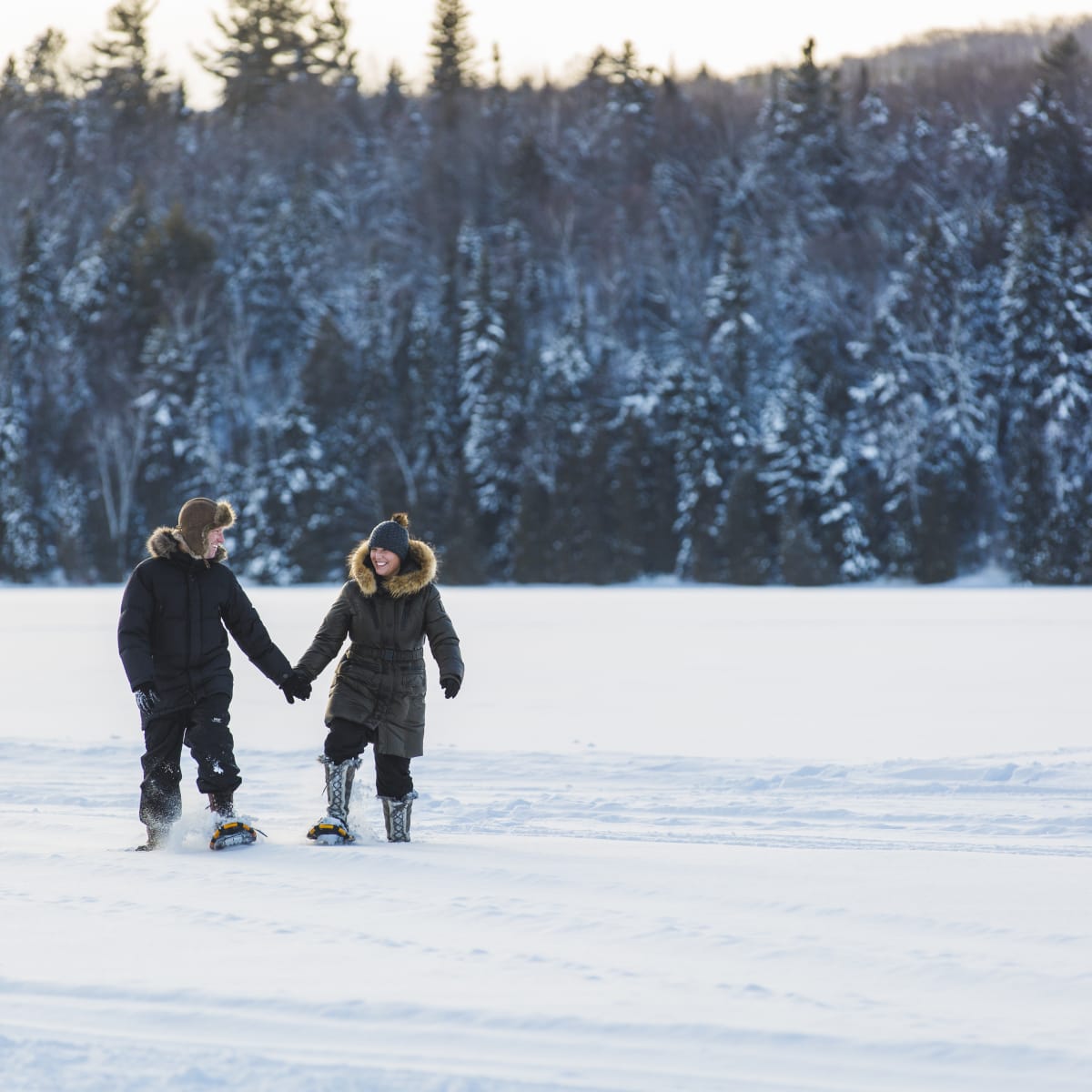 A couple snowshoeing