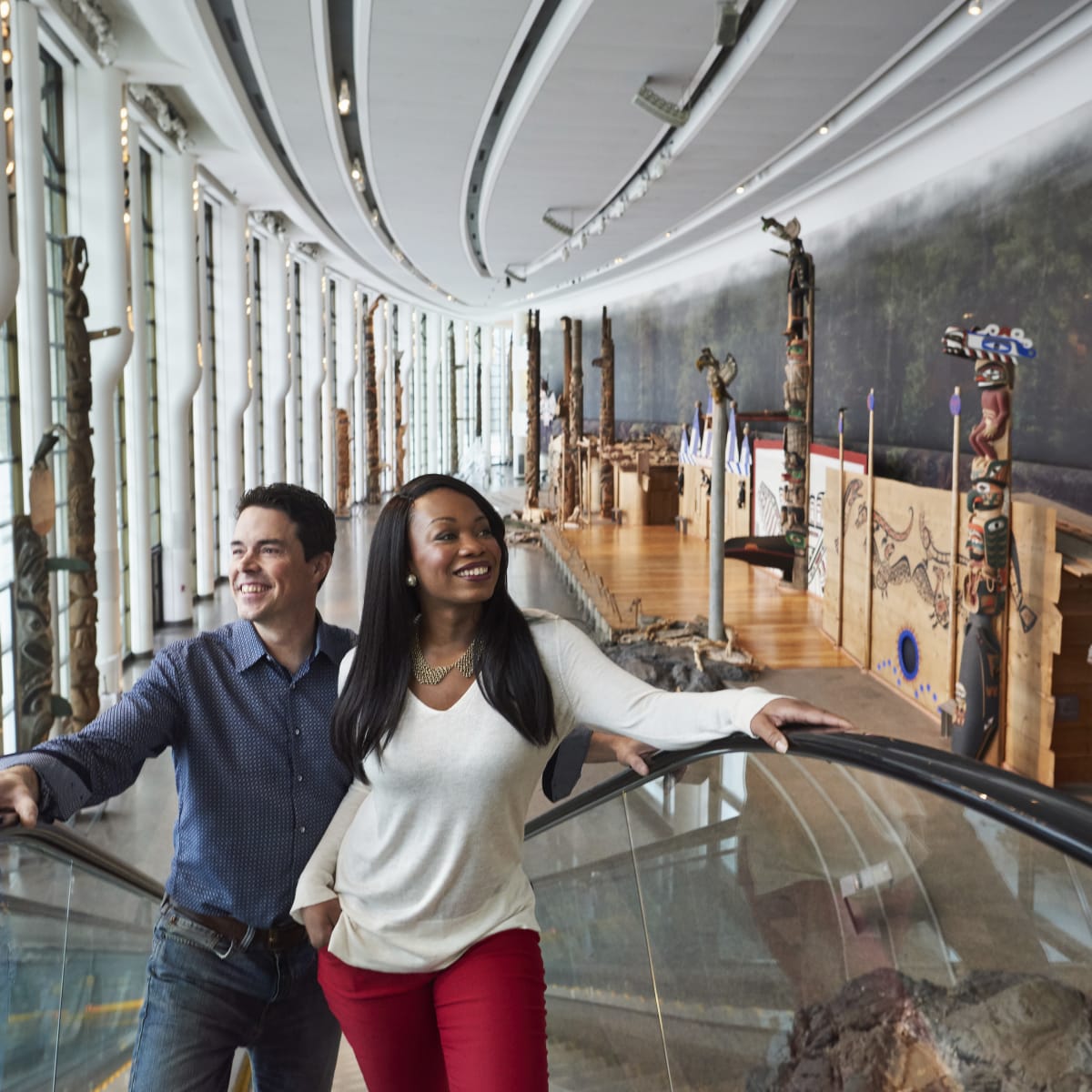 Couple on an escalator inside the Canadian History Museum.