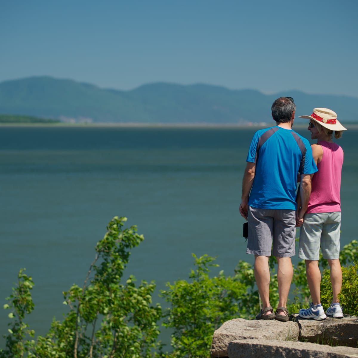 Couple watching the river after a hike.