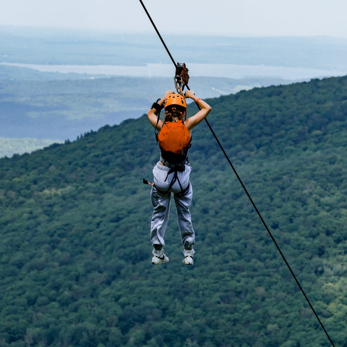 Woman on a zipline.