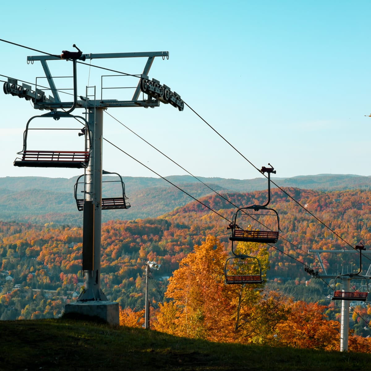 Ski lift and fall scenery at Sommet Saint-Sauveur.
