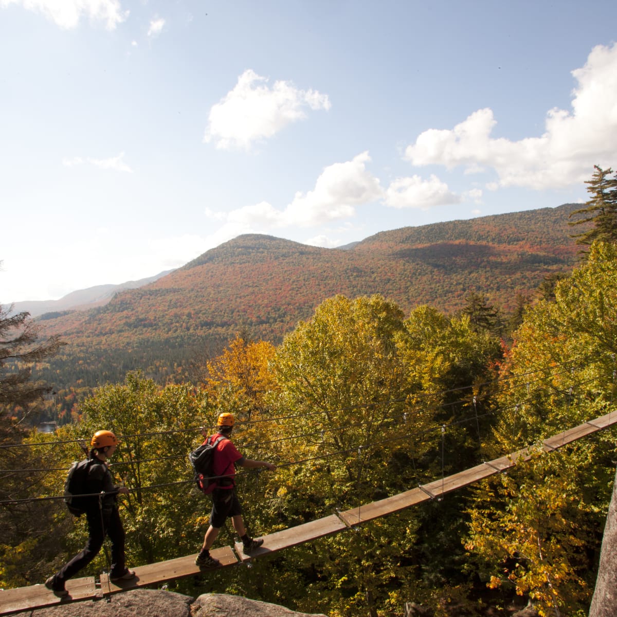 Two people on a via ferrata at the parc national du Mont-Tremblant.