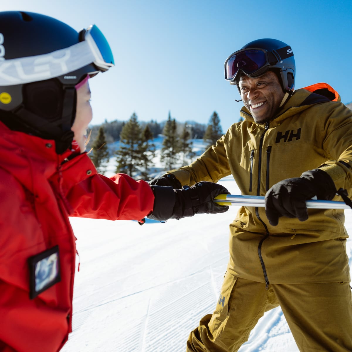Smiling man learning how to ski.