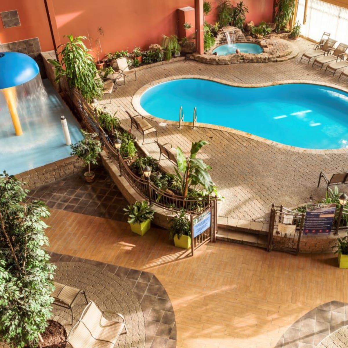Elevated view of the pool and spa area at Hotel Ambassadeur