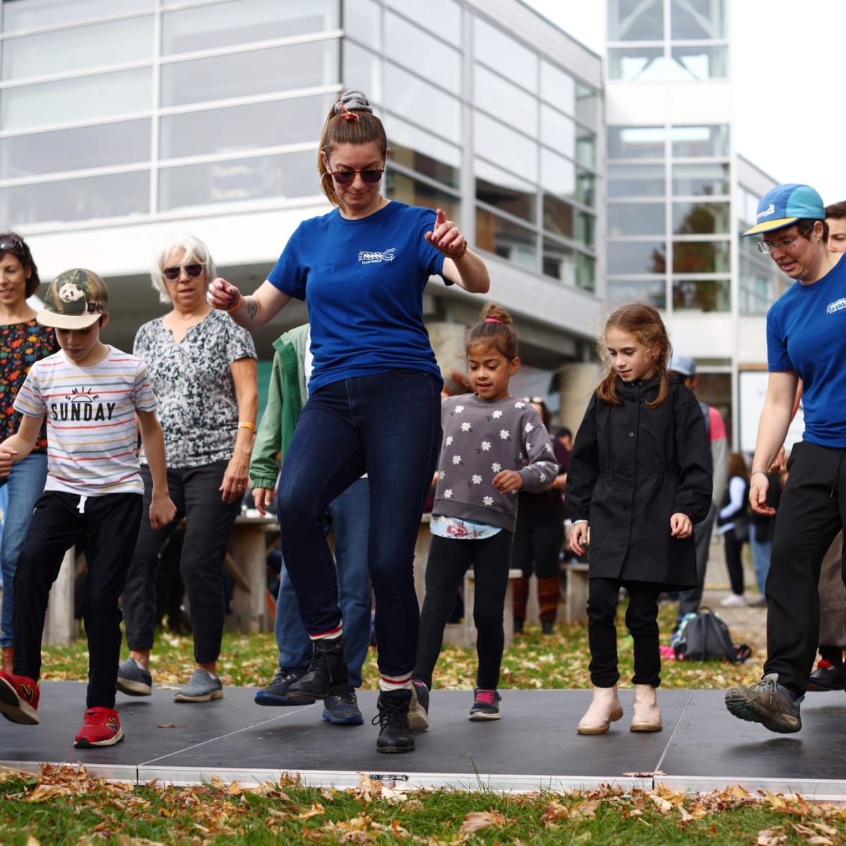 Group of kids learning a dance.