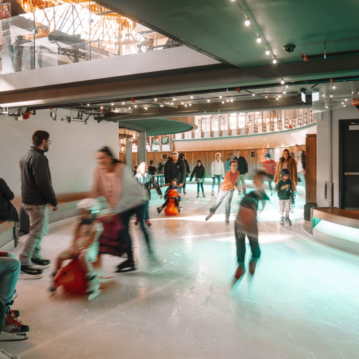 Families skating on the indoor rink at Mega Parc