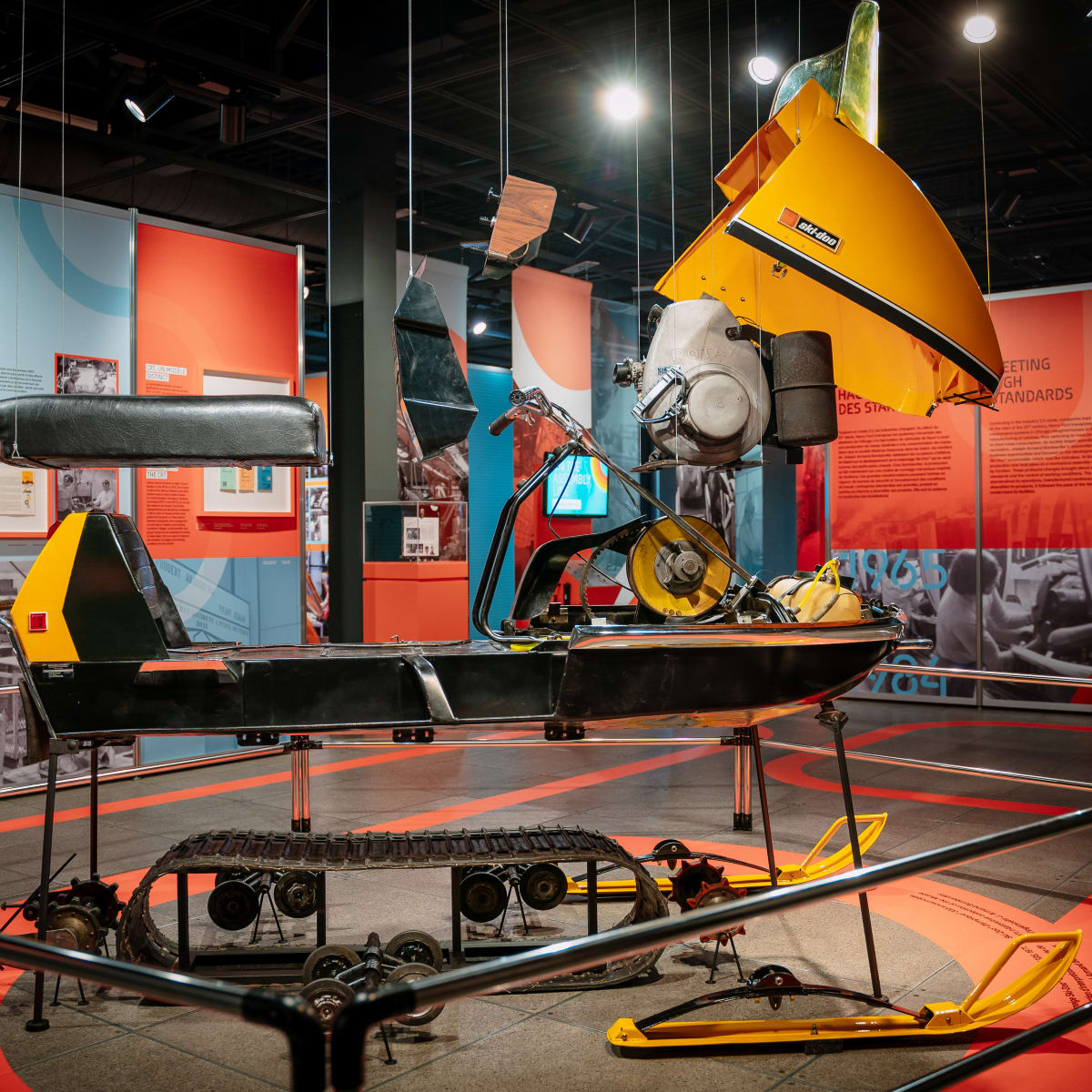 Display of pieces of a snowmobile at the Bombardier museum.