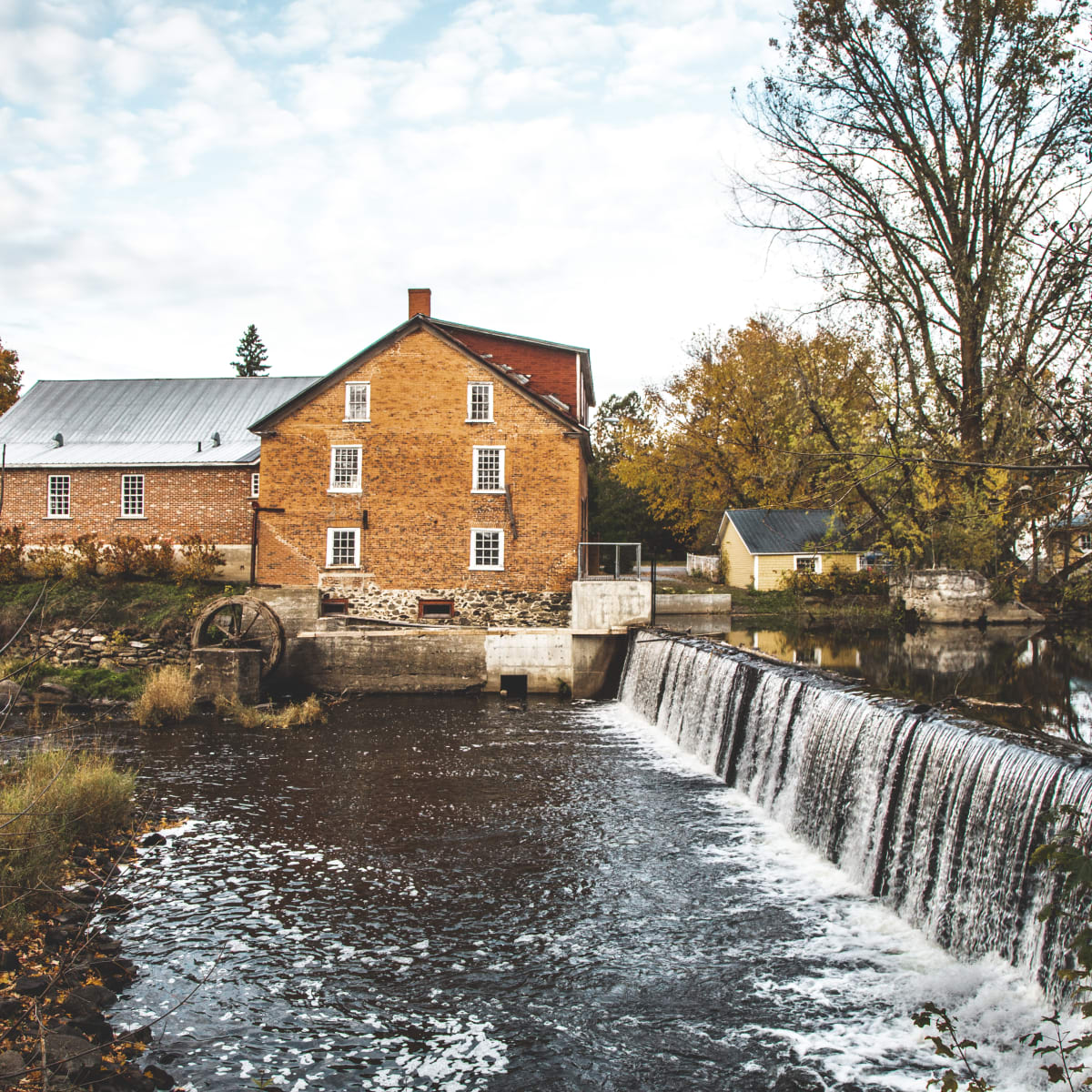 Heritage building on the banks of a river.