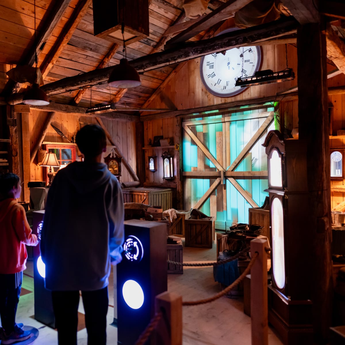 Family in the clock workshop at the Village Québécois d'Antan