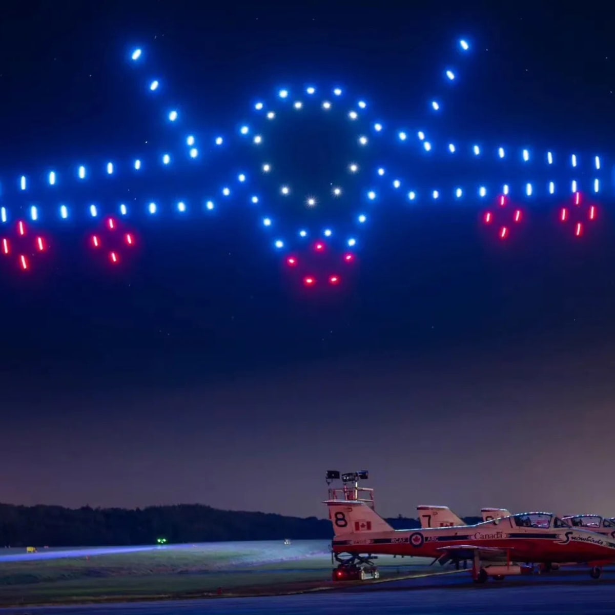 AERO Gatineau-Ottawa Airshow - Illuminated drones form a plane in the sky.