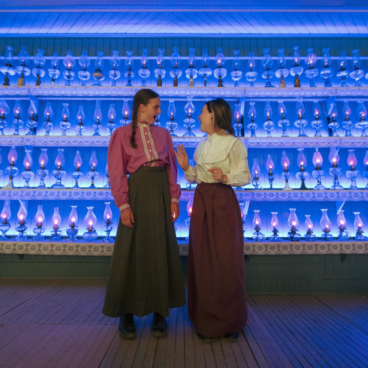 Two actresses in period costumes at the Village Québécois d'Antan.
