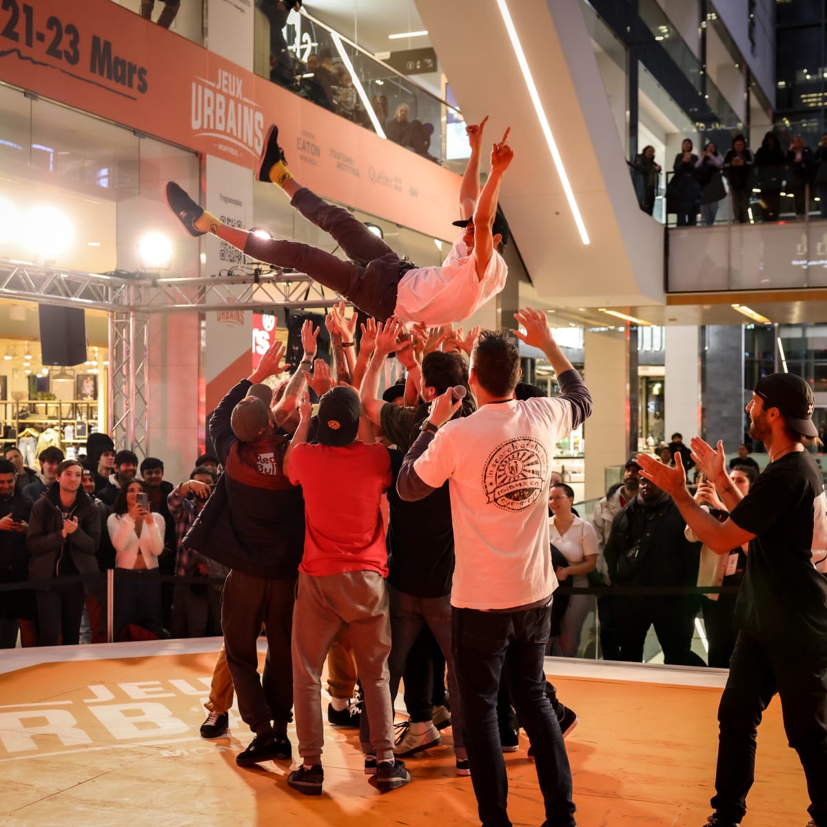 XP_MTL - People celebrate by lifting a man up