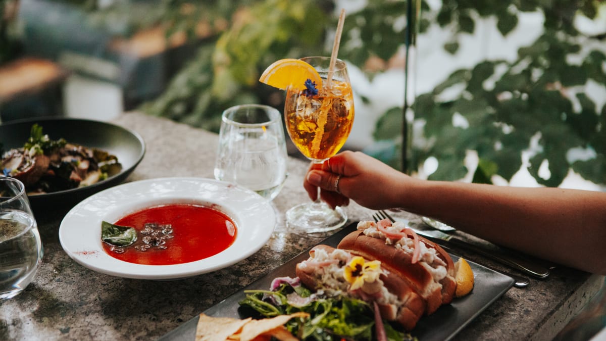 Gourmet platter and spritz served al fresco.
