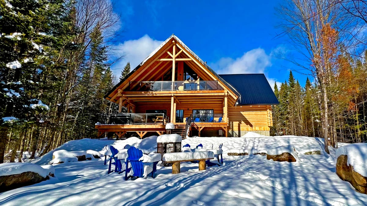 Front of a two-storey log cabin