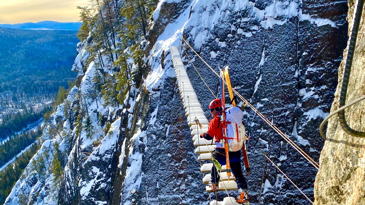 The suspension bridge of a via ferrata course under the snow