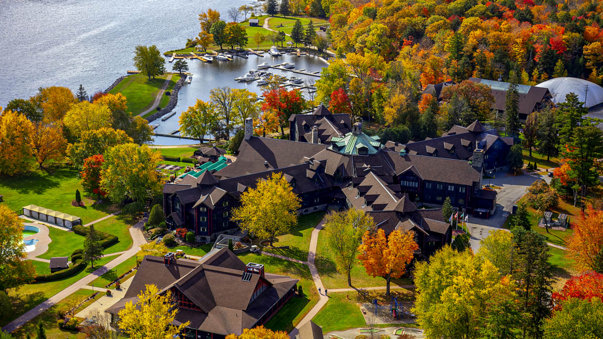 Fairmont Le Château Montebello and the Ottawa River in the fall.