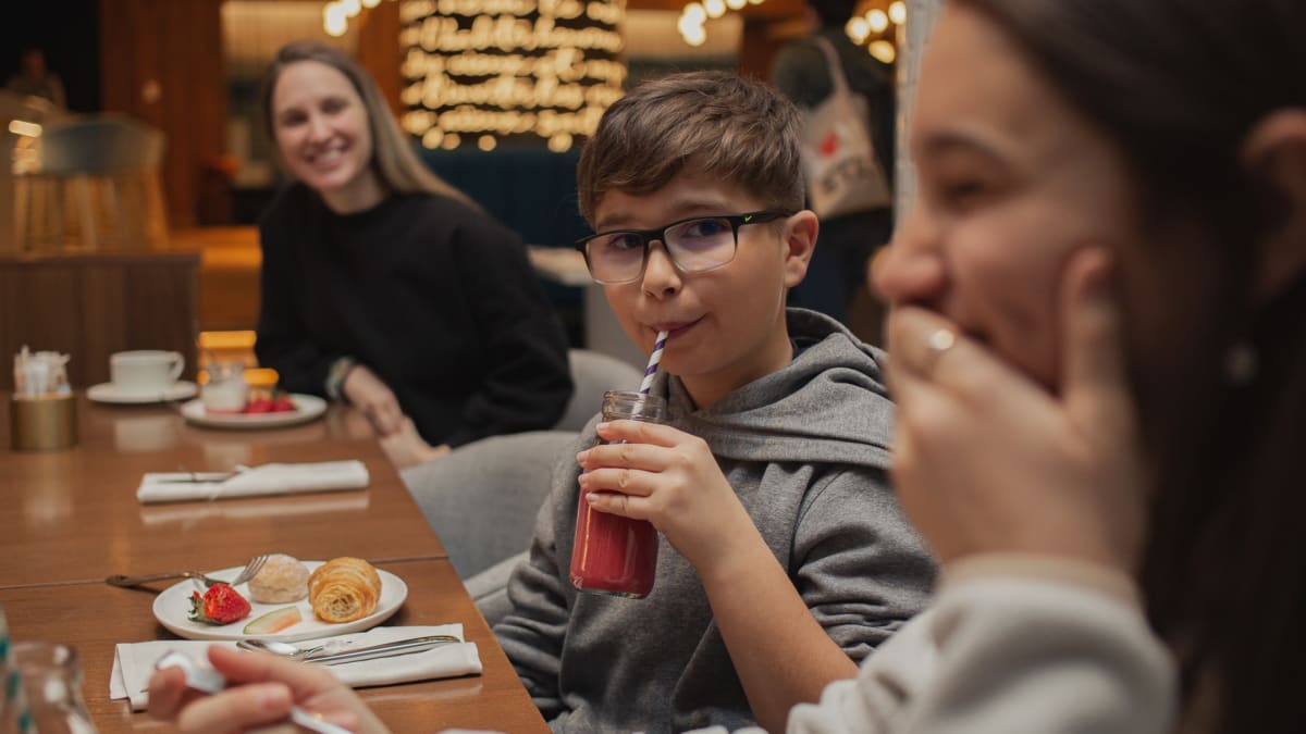 Kids having supper in a restaurant.