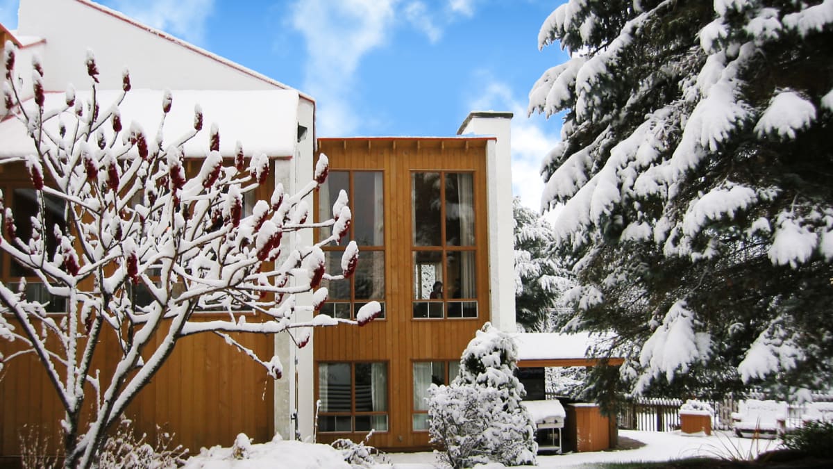 Exterior of Hotel Chéribourg under a blanket of snow