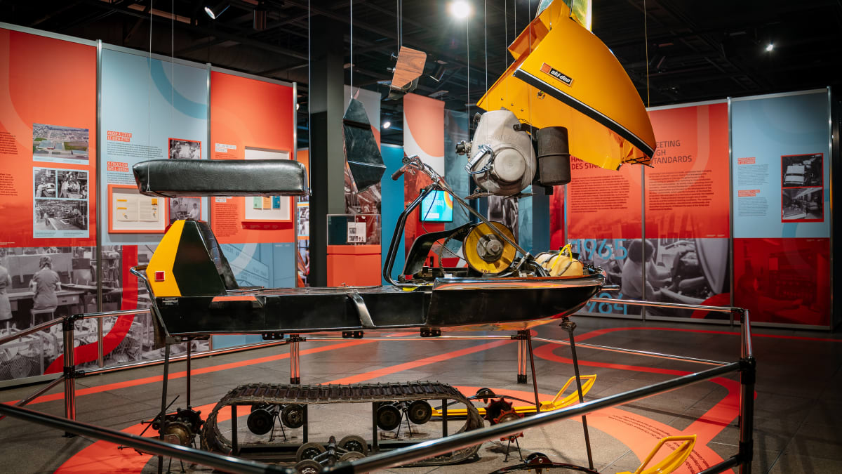 Display of pieces of a snowmobile at the Bombardier museum.