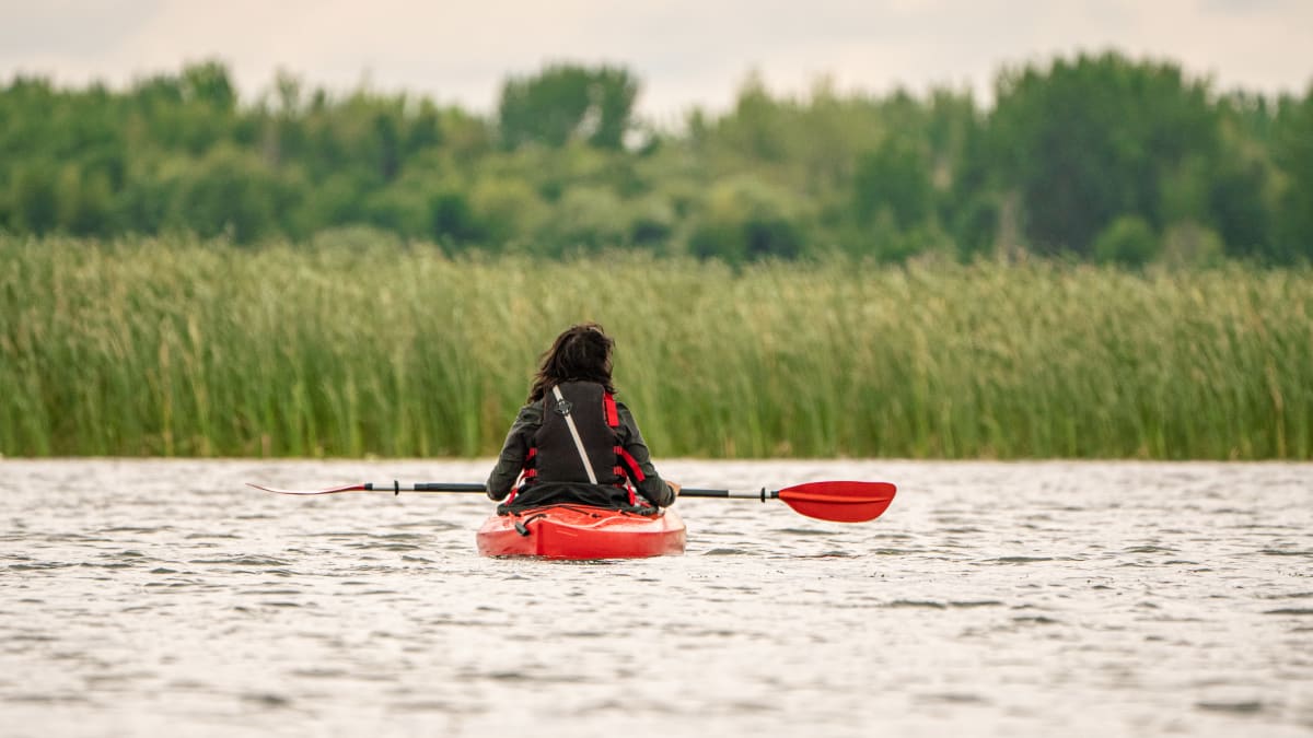 Woman on a kayak.