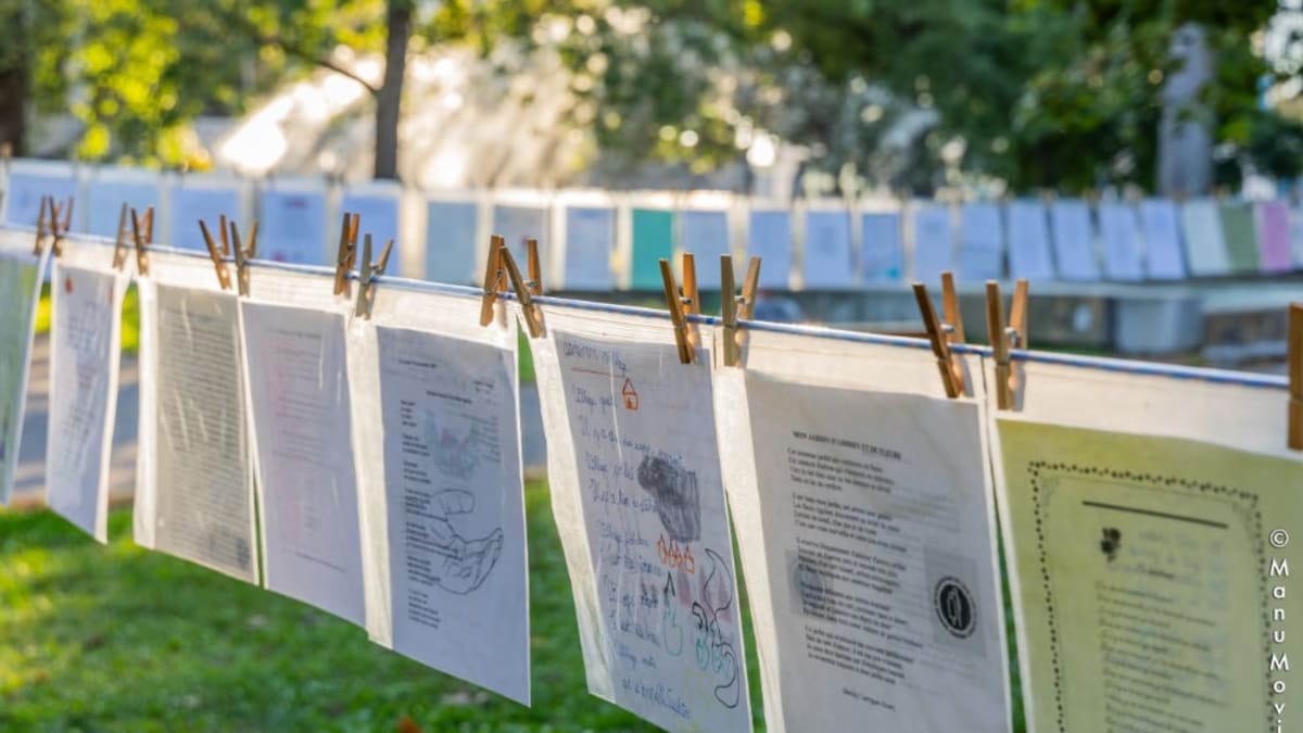 Outdoor rope on which poems have been clipped.
