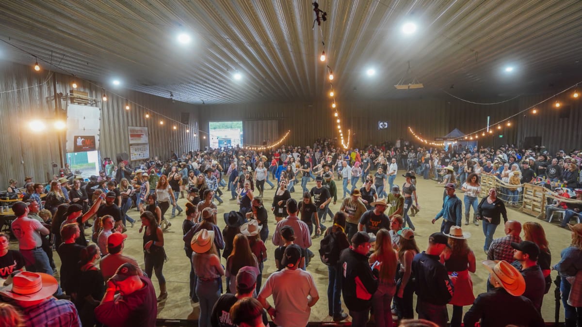 Country dancers in a barn at the Ayer's Cliff Rodeo.