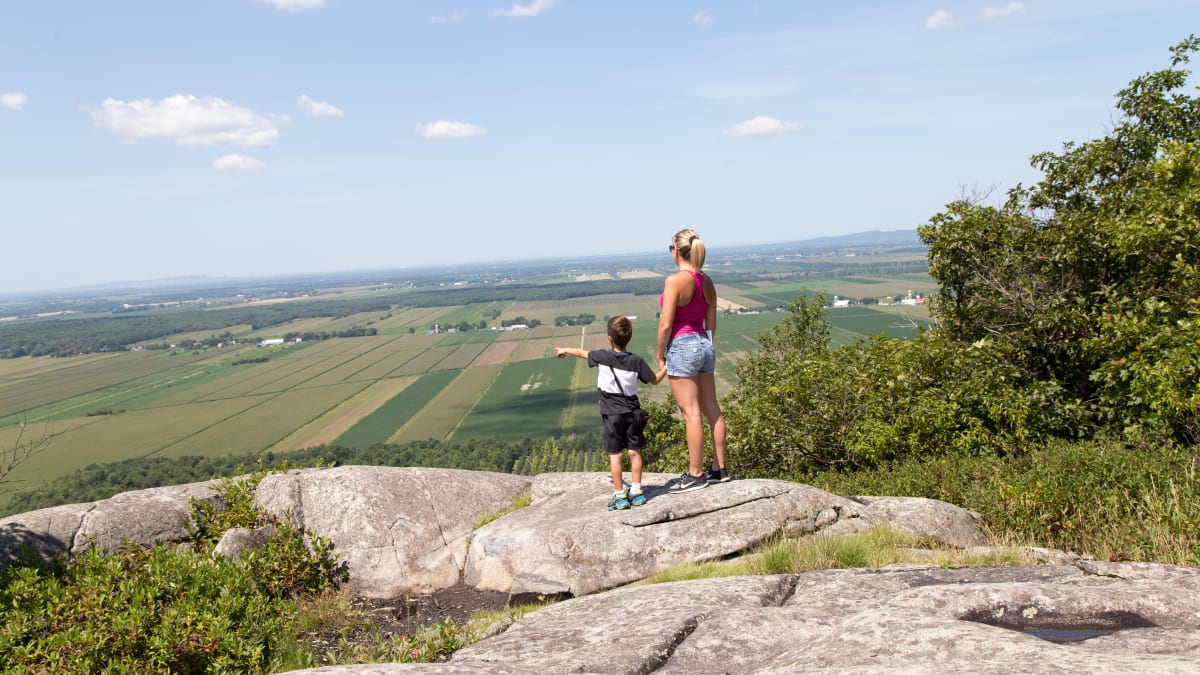 Mother and son on top of a mountain in Haut-Richelieu.