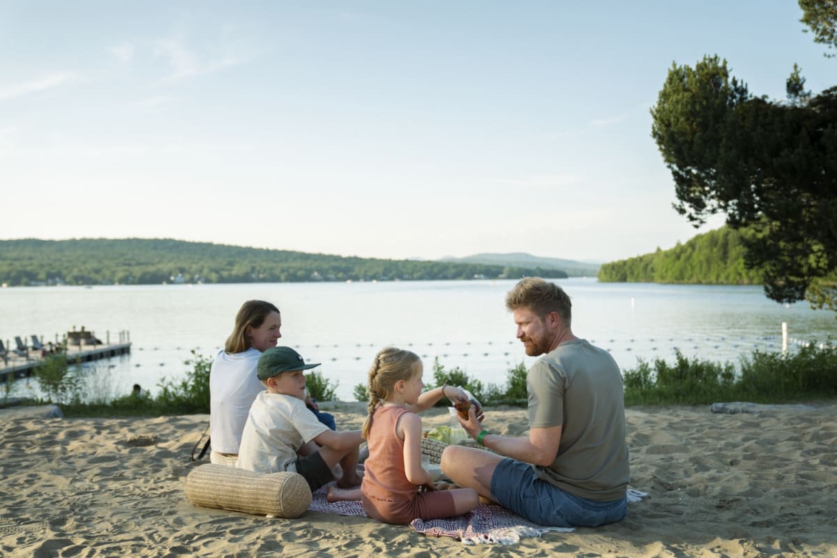 Young family at the beach at Station touristique Duchesnay.