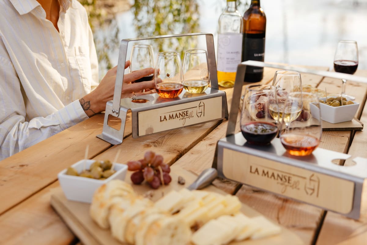 Tasting platters and appetizers on an outdoor table at Vignoble La Manse.
