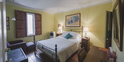 The Auguste room: double bed, shared bathroom