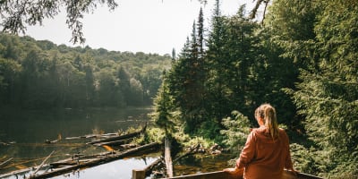 Interpretation trails and circuits in Petite Nation - A woman observing nature