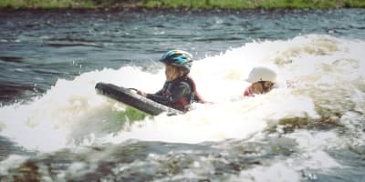 A little girl is having fun in the water at New Wave Expeditions
