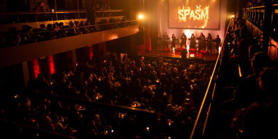 SPASM Festival -  Dark venue filled with spectators.