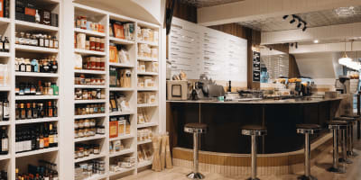 Display of local products and counter at Albert Café.