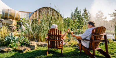 Vignoble de Pomone - A couple sitting on chairs outside