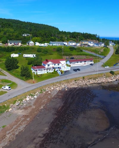 Aerial view of the Hôtel Motel Grande-Vallée on the waterfront.