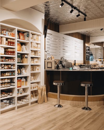 Display of local products and counter at Albert Café.