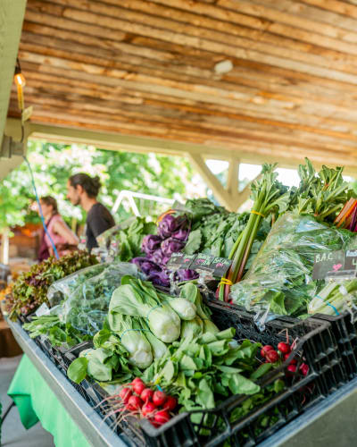 Compton evening market - A kiosk full of vegetables.